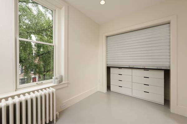 BOWA design build row home renovation in Washington, DC Baby Room Closet with Rolling Door