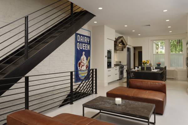 BOWA design build row home renovation in Washington, DC Industrial kitchen with metal staircase