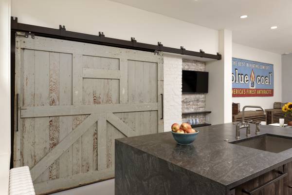 BOWA design build row home renovation in Washington, DC industrial kitchen Sliding Door Pantry