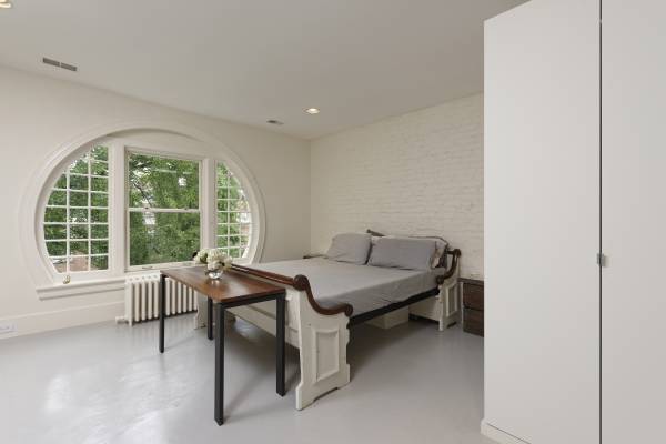 BOWA design build row home renovation in Washington, DC Master Bedroom with Round Window