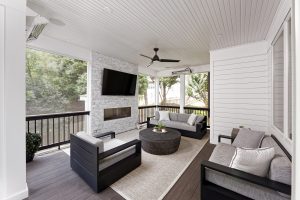 outdoor renovation featuring a screened in porch with fireplace