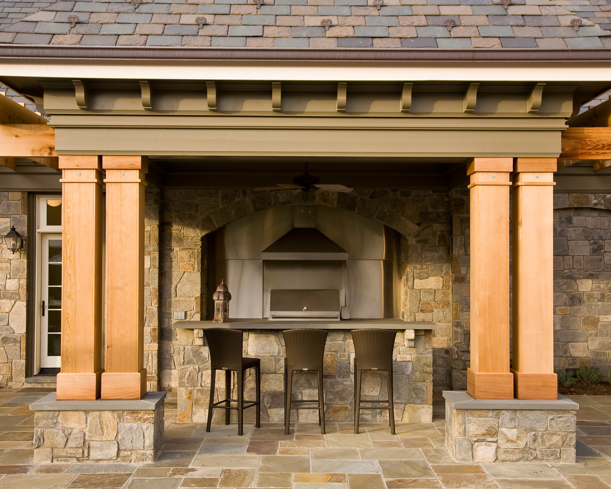 outdoor renovation features a bar and pizza oven